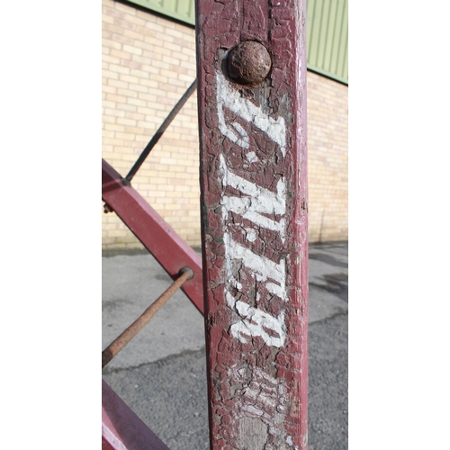 1203 - C20th L.N.E.R. heavy duty large luggage porters trolley with cast wheels, painted in red, stamped nu... 