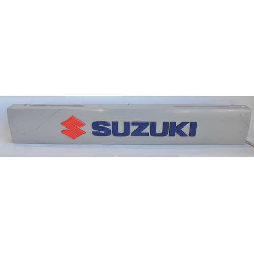 41 - Illuminated Suzuki dealership advertising board, metal case with plastic relief lettering in full wo... 