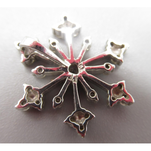 15 - White metal snowflake set with diamonds, with indistinct mark, 2.42g and a 9ct white gold heart pend... 