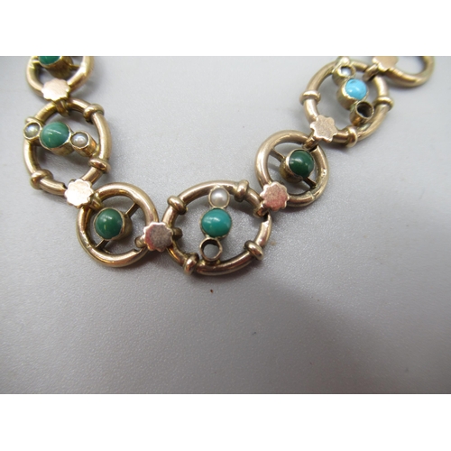 32 - 9ct yellow gold bracelet set with blue and green stones and seed pearls (two pearls missing), with b... 