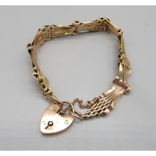 5 - 9ct yellow gold bar gate bracelet with padlock clasp and safety chain, stamped 375, 15.6g