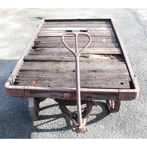 1215 - C20th 4 wheeled rail cart, with twin handle pulley, cast metal frame, L185cm W117cm H56cm, wheel dia... 