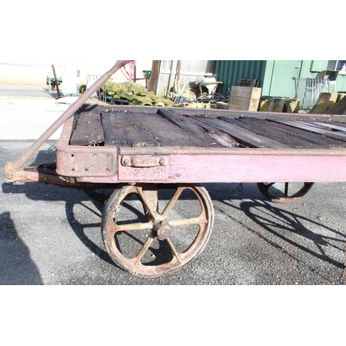 1215 - C20th 4 wheeled rail cart, with twin handle pulley, cast metal frame, L185cm W117cm H56cm, wheel dia... 