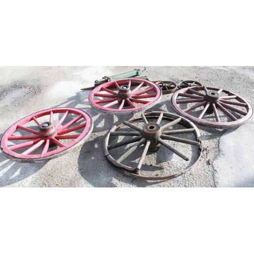 1223 - Assorted collection of coopered wheels, pair of cast wheels, axle and swivels, metal strapping, etc.