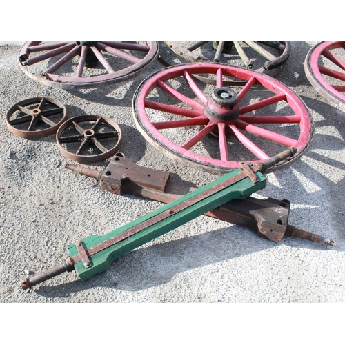 1223 - Assorted collection of coopered wheels, pair of cast wheels, axle and swivels, metal strapping, etc.