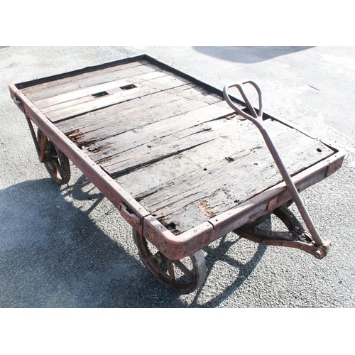 1215 - C20th 4 wheeled rail cart, with twin handle pulley, cast metal frame, L185cm W117cm H56cm, wheel dia... 