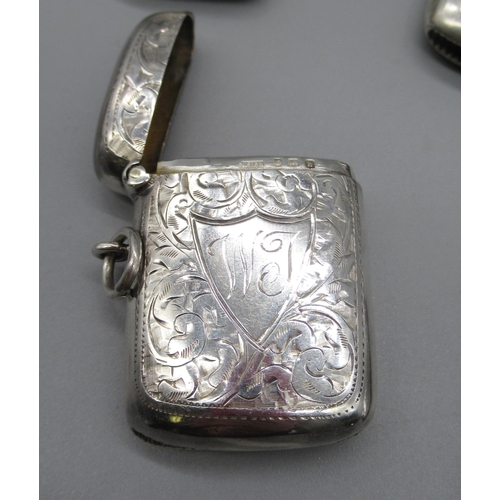 64 - Hallmarked Sterling silver vesta without decoration, by William Aitken, Chester, 1902, and four othe... 