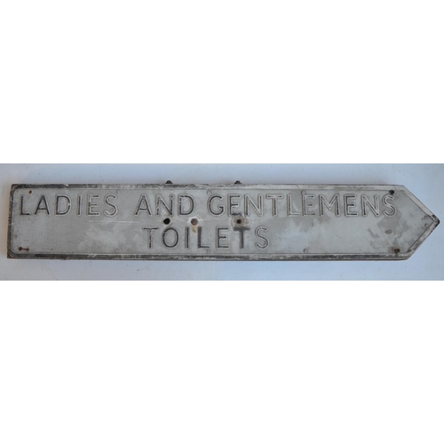 291 - Vintage relief text pressed metal Ladies And Gentlemen's Toilets sign on steel frame, 104x18cm