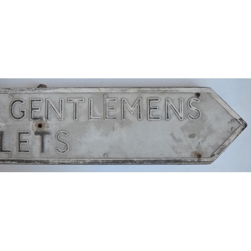 291 - Vintage relief text pressed metal Ladies And Gentlemen's Toilets sign on steel frame, 104x18cm