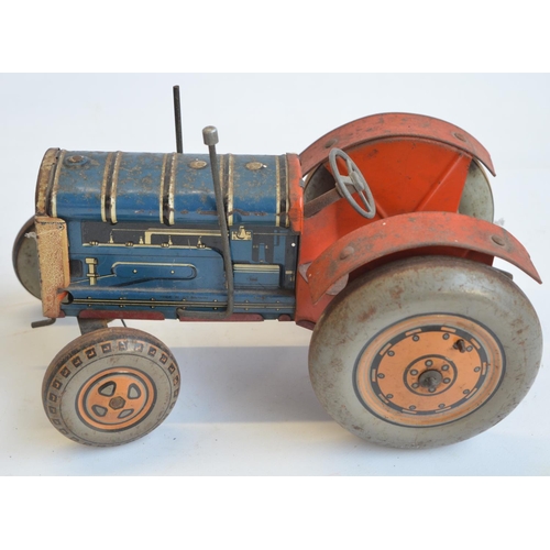 213 - Vintage tinplate lithographed clockwork tractor model, marked Made In Great Britain but no makers ma... 