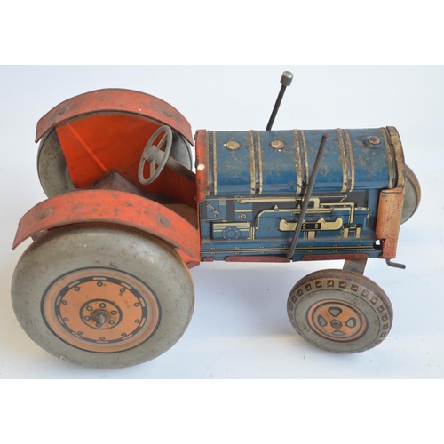 213 - Vintage tinplate lithographed clockwork tractor model, marked Made In Great Britain but no makers ma... 