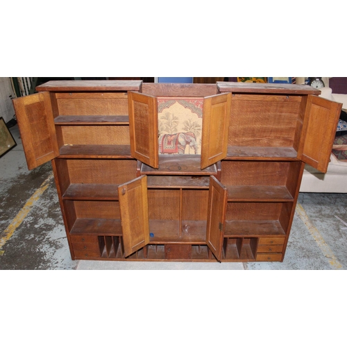 696 - Edwardian oak stationery cabinet, with four cupboards, six drawers and twelve compartments, W150cm D... 