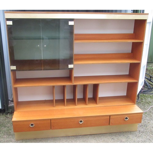 655 - 1970s wall unit, with two smoked glass doors and shelves with record storage on a three drawer base ... 