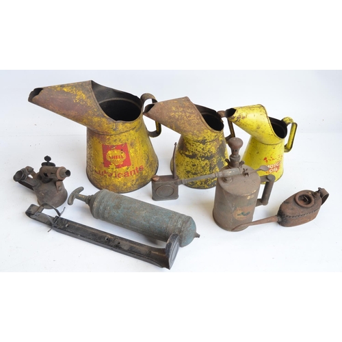 135 - Collection of vintage oil cans to include Shell Lubricants, a blow torch, fire extinguisher, extingu... 