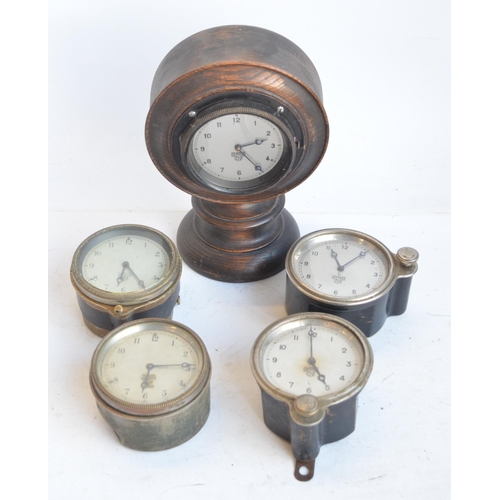 139 - Five vintage car clocks by Smiths to include a desktop mounted example, H21cm