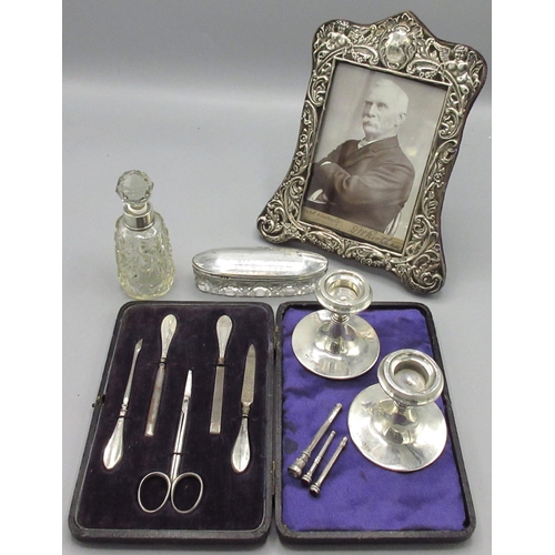 100 - Collection of table silverware incl. Edwardian silver decorative repousse picture frame, cherub moti... 