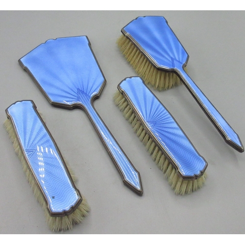 93 - Four Piece Art Deco blue enamel and silver dressing table set incl. three brushes and a hand mirror,... 