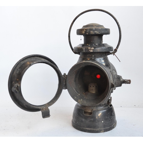 143 - A box style BR(M) railway lamp (height with handle stowed 31.3cm) and Lucas No745 