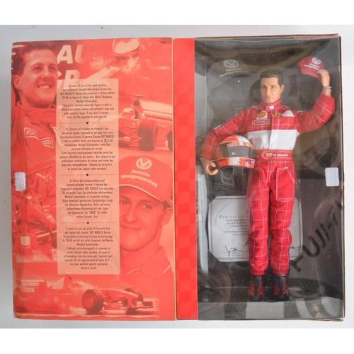 149 - Collection of Michael Schumacher and Ferrari related items to include framed print by Stuart McIntyr... 