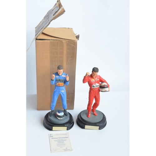 150 - Two hand painted cold cast porcelain figurines of Michael Schumacher, one with shipping box and limi... 