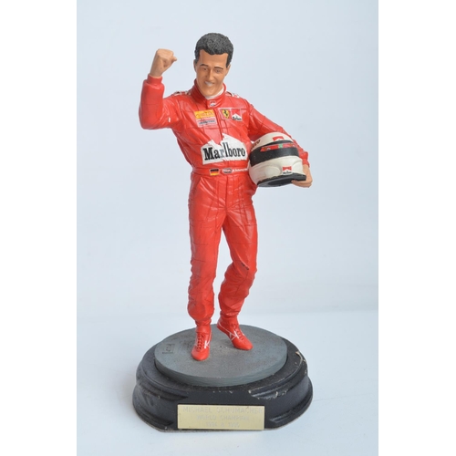 150 - Two hand painted cold cast porcelain figurines of Michael Schumacher, one with shipping box and limi... 