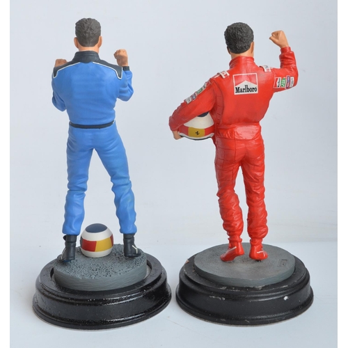 150 - Two hand painted cold cast porcelain figurines of Michael Schumacher, one with shipping box and limi... 