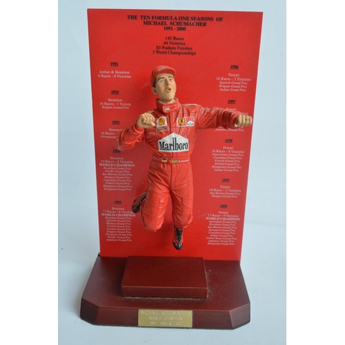 151 - Hand painted cold cast 1/9th scale porcelain figurine of Michael Schumacher by Sheercast  with mahog... 