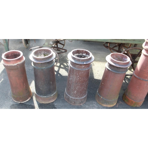 1235 - Three salt glazed 'Cannon' chimney pots 75cm and one terracotta pot 72cm  (4)