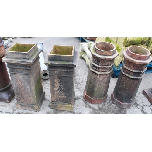 1238 - Two Octagonal salt glazed chimney pots and two square terracotta pots. 80cm