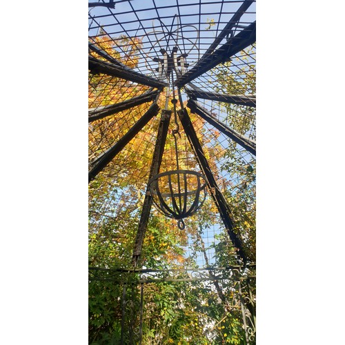 1252 - Large ornate Victorian style steel pergola gazebo with seating and table to match. With plant hangin... 