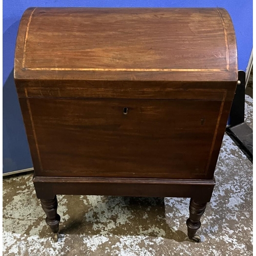 593 - C19th mahogany dome top cellarette, outlined with satinwood band on ring turned tapered legs with br... 