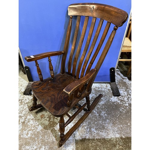 438 - Early C20th ash and elm slat back kitchen Windsor rocking chair, seat stamped JM (1920)Ltd.