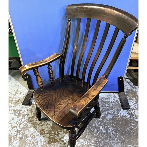 439 - Early C20th ash and elm slat back Windsor chair, seat stamped W.O. on turned supports with twin stre... 