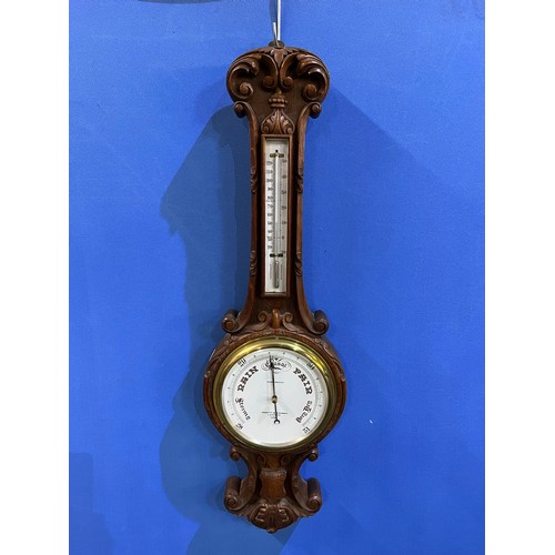 569 - C20th carved oak cased Negretti & Zambra Aneroid barometer and thermometer, No.27238, H91cm