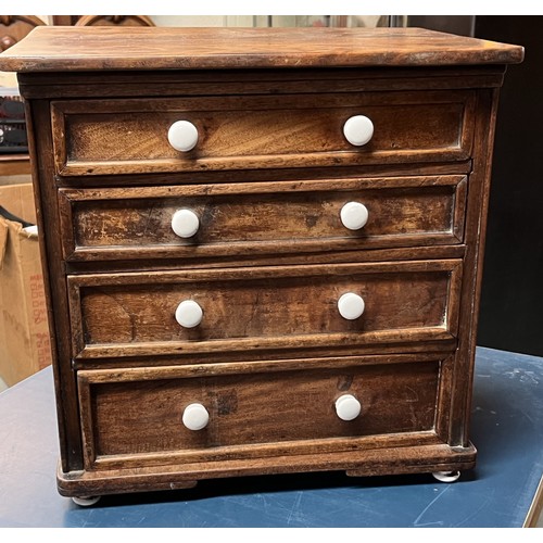 601 - Mahogany collectors type chest of four drawers with ceramic handles and feet, W41cm D32cm H40cm