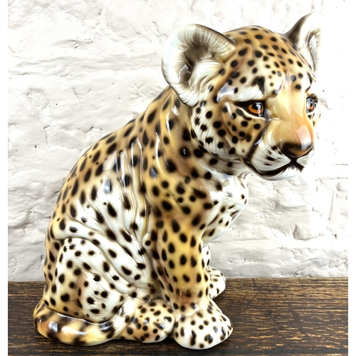 129 - Large ceramic model of a leopard cub, stamped made in Italy, H45cm