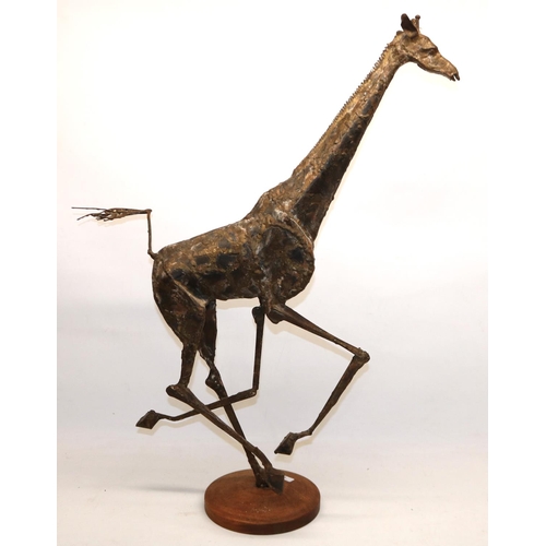 132 - Large welded metal sculpture of a running giraffe, on wooden base, H82cm