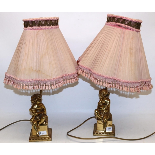 141 - Pair of brass cherub table lamps with shades, H58cm (2)