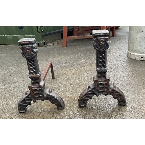 1254 - A pair of Victorian black cast firedogs