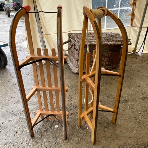 1264 - Two wooden sledges with metal runners