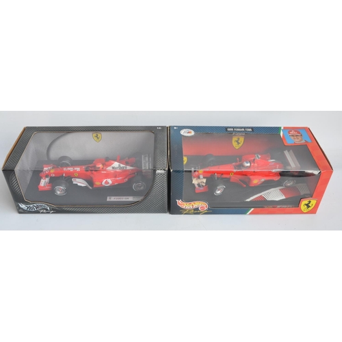 162 - Two 1/18 scale diecast Michael Schumacher F1 Ferrari models from Hot Wheels Racing with seated drive... 