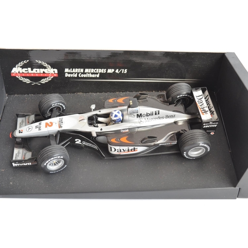 167 - Two 1/18 scale diecast F1 David Coulthard McLaren Mercedes models from Minichamps/Paul's Model Art w... 