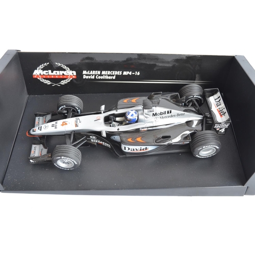 167 - Two 1/18 scale diecast F1 David Coulthard McLaren Mercedes models from Minichamps/Paul's Model Art w... 