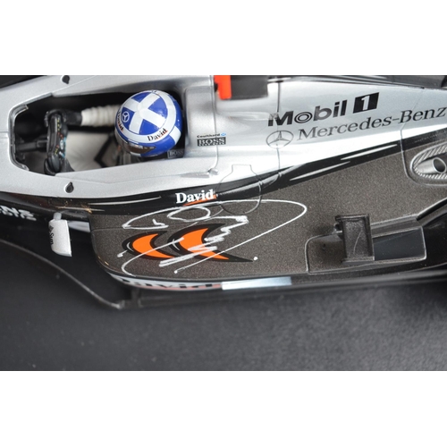 168 - Two 1/18 scale diecast F1 David Coulthard McLaren Mercedes models from Minichamps/Paul's Model Art w... 