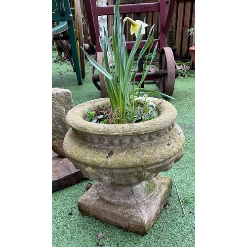 1288 - A pair of Reconstituted stone urns on plinth (3)