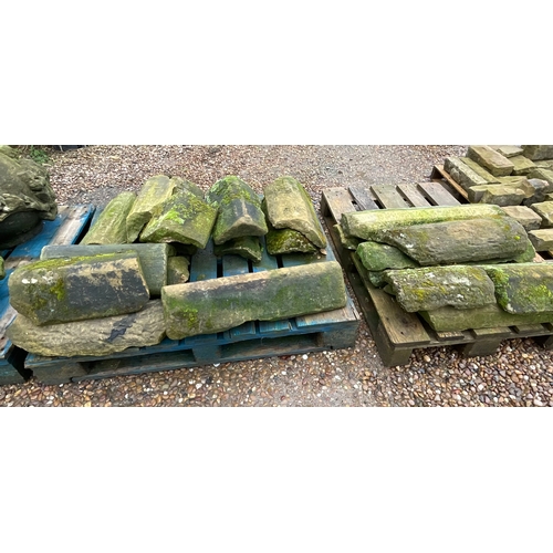 1289 - Two pallets containing a quantity of sandstone ridge tiles in various conditions