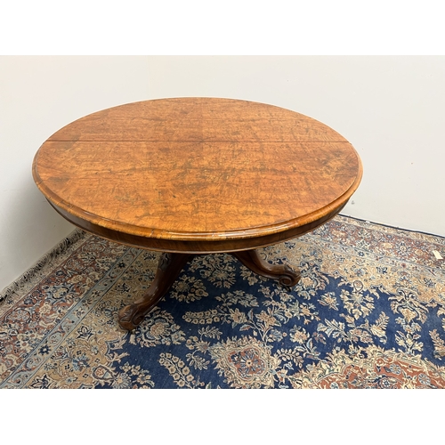 455 - Victorian figured walnut breakfast table, circular top on carved column and three cabriole legs, D11... 