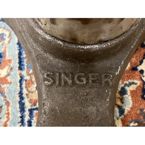 491 - Singer industrial machinist's stool, circular leather seat on cast iron base, moulded 'Singer' to th... 