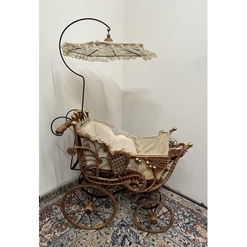 497 - Victorian style metal framed dolls pram with upholstered cane work cradle and lace parasol, H110cm i... 