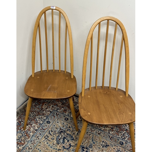 499 - Two Ercol Quaker stick back dining chairs, H95cm, both with gold sticker